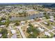 An aerial view of the neighborhood near a community lake and recreational area at 22275 Belinda Ave, Port Charlotte, FL 33952
