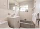 Neutral bathroom featuring a tub and vanity with storage at 22275 Belinda Ave, Port Charlotte, FL 33952