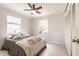 Bedroom featuring a ceiling fan, closet, and multiple windows at 22275 Belinda Ave, Port Charlotte, FL 33952