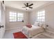 Comfortable bedroom featuring two windows, ceiling fan and closet at 22275 Belinda Ave, Port Charlotte, FL 33952