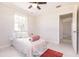 Cozy bedroom featuring a ceiling fan and neutral decor at 22275 Belinda Ave, Port Charlotte, FL 33952