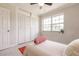 Bedroom featuring a large window, closet, and neutral decor at 22275 Belinda Ave, Port Charlotte, FL 33952