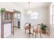 Dining area with terrazzo flooring and views into the bright kitchen at 22275 Belinda Ave, Port Charlotte, FL 33952