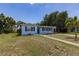 Inviting single-Gathering home with well-manicured lawn and mature landscaping at 22275 Belinda Ave, Port Charlotte, FL 33952