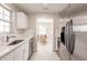 Bright kitchen featuring stainless steel appliances and a view to a dining area at 22275 Belinda Ave, Port Charlotte, FL 33952