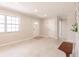 Neutral living room featuring terrazzo flooring, recessed lighting, and bright windows at 22275 Belinda Ave, Port Charlotte, FL 33952