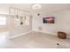 Spacious living room with partition, neutral paint, and terrazzo flooring at 22275 Belinda Ave, Port Charlotte, FL 33952