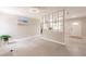Open-concept living room featuring terrazzo floors and neutral paint colors at 22275 Belinda Ave, Port Charlotte, FL 33952