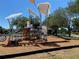Modern playground equipment at the community park featuring slides and climbing structures at 22275 Belinda Ave, Port Charlotte, FL 33952