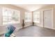 Inviting sunroom with ample light, new flooring, and an exit door at 22275 Belinda Ave, Port Charlotte, FL 33952