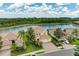 Beautiful aerial view of home on the water with manicured landscaping and a brick driveway at 235 River Enclave Ct, Bradenton, FL 34212