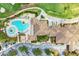 An aerial view of the community clubhouse and golf course with lush landscaping at 235 River Enclave Ct, Bradenton, FL 34212