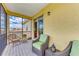 Inviting screened balcony features wicker furniture, providing a relaxing outdoor living space with a view at 235 River Enclave Ct, Bradenton, FL 34212