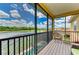 Balcony overlooking a beautiful lake with comfortable seating and scenic views at 235 River Enclave Ct, Bradenton, FL 34212