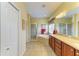 Bright bathroom featuring dual sinks, tub and separate shower at 235 River Enclave Ct, Bradenton, FL 34212