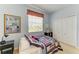 Cozy bedroom with a window view and storage in the double door closet at 235 River Enclave Ct, Bradenton, FL 34212