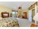 Spacious bedroom with private balcony, furniture set and light carpet at 235 River Enclave Ct, Bradenton, FL 34212