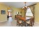 Bright dining room features a chandelier and is adjacent to the foyer entrance at 235 River Enclave Ct, Bradenton, FL 34212