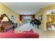 Open living space featuring a piano and views of the pool and lake at 235 River Enclave Ct, Bradenton, FL 34212