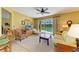 The living room features a ceiling fan, sliding glass doors to the screened-in patio and pool area at 235 River Enclave Ct, Bradenton, FL 34212