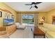Comfortable living room with a ceiling fan and sliding glass doors to the pool area at 235 River Enclave Ct, Bradenton, FL 34212