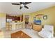 The living room is open to the kitchen with seating at the bar and features natural light at 235 River Enclave Ct, Bradenton, FL 34212