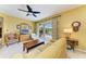 A cozy living room with a view of the screened-in lanai and pool through sliding glass doors at 235 River Enclave Ct, Bradenton, FL 34212