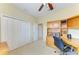 Functional office space with a built-in desk, storage cabinets, and neutral carpet at 235 River Enclave Ct, Bradenton, FL 34212