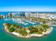 Stunning aerial view of the marina showcasing boats and waterfront condos in a vibrant coastal city at 2419 Riverbluff Pkwy # V233, Sarasota, FL 34231