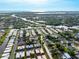 Aerial view of the neighborhood with proximity to the water at 2419 Riverbluff Pkwy # V233, Sarasota, FL 34231