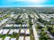 Community aerial view showcases lush landscaping and neighborhood layout at 2419 Riverbluff Pkwy # V233, Sarasota, FL 34231