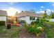 Inviting backyard with patio, grill, and lush landscaping at 2419 Riverbluff Pkwy # V233, Sarasota, FL 34231