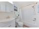 Bright bathroom featuring a tub, shower, vanity, and a mirrored cabinet at 2419 Riverbluff Pkwy # V233, Sarasota, FL 34231