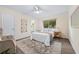 Cozy bedroom showcasing a comfortable bed, natural light, and neutral decor at 2419 Riverbluff Pkwy # V233, Sarasota, FL 34231