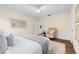 Bedroom featuring an armchair, ample natural light, and neutral decor at 2419 Riverbluff Pkwy # V233, Sarasota, FL 34231