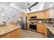 Updated kitchen with stainless steel appliances and a center island at 2419 Riverbluff Pkwy # V233, Sarasota, FL 34231
