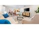 Bright living room featuring modern furniture, an open layout, and stylish decor at 2419 Riverbluff Pkwy # V233, Sarasota, FL 34231
