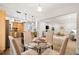 Open-concept living space with an eat-in kitchen, dining area, and living room at 2419 Riverbluff Pkwy # V233, Sarasota, FL 34231