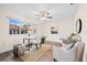 Bright and airy home office with a large window and ceiling fan at 2419 Riverbluff Pkwy # V233, Sarasota, FL 34231