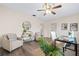 Comfortable home office with neutral decor, ceiling fan, and ample seating at 2419 Riverbluff Pkwy # V233, Sarasota, FL 34231