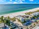 Gorgeous aerial view of beachfront property with stunning Gulf views and pristine white sand at 2500 Gulf N Dr, Bradenton Beach, FL 34217