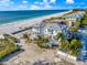 Aerial view of beachfront property with stunning views of ocean, beach, and surrounding neighborhood at 2500 Gulf N Dr, Bradenton Beach, FL 34217