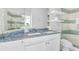 Elegant bathroom with double sinks, decorative countertop, and walk-in shower with mosaic tile accents at 2500 Gulf N Dr, Bradenton Beach, FL 34217