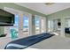This bedroom features balcony access with amazing views, creating a serene retreat at 2500 Gulf N Dr, Bradenton Beach, FL 34217