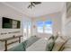 Bright bedroom showcasing a water view, TV, beach decor, and comfy accents that enhance the space at 2500 Gulf N Dr, Bradenton Beach, FL 34217