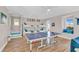 Spacious game room with bunk beds, ping pong table, and cozy window nook for leisure and entertainment at 2500 Gulf N Dr, Bradenton Beach, FL 34217