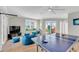Relaxed game room with comfy beanbags, TV, water views, and ping pong table perfect for entertaining at 2500 Gulf N Dr, Bradenton Beach, FL 34217