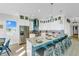 Elegant kitchen with breakfast bar, stainless steel appliances, and custom cabinetry at 2500 Gulf N Dr, Bradenton Beach, FL 34217