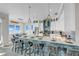 Modern kitchen with large island, bar seating, stainless steel appliances, and stylish lighting at 2500 Gulf N Dr, Bradenton Beach, FL 34217