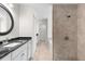 Elegant bathroom showcasing a granite countertop vanity, tiled shower, and ample storage space at 2575 Johannesberg Rd, North Port, FL 34288